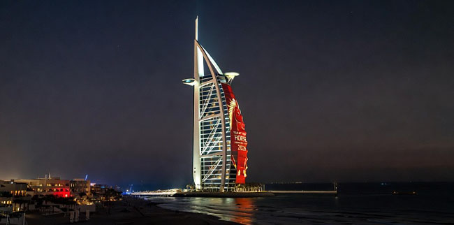 Night time Burj Al Arab displaying Chinese New Year Horse projection Burj Al Arab Lunar new Year light show 2026
